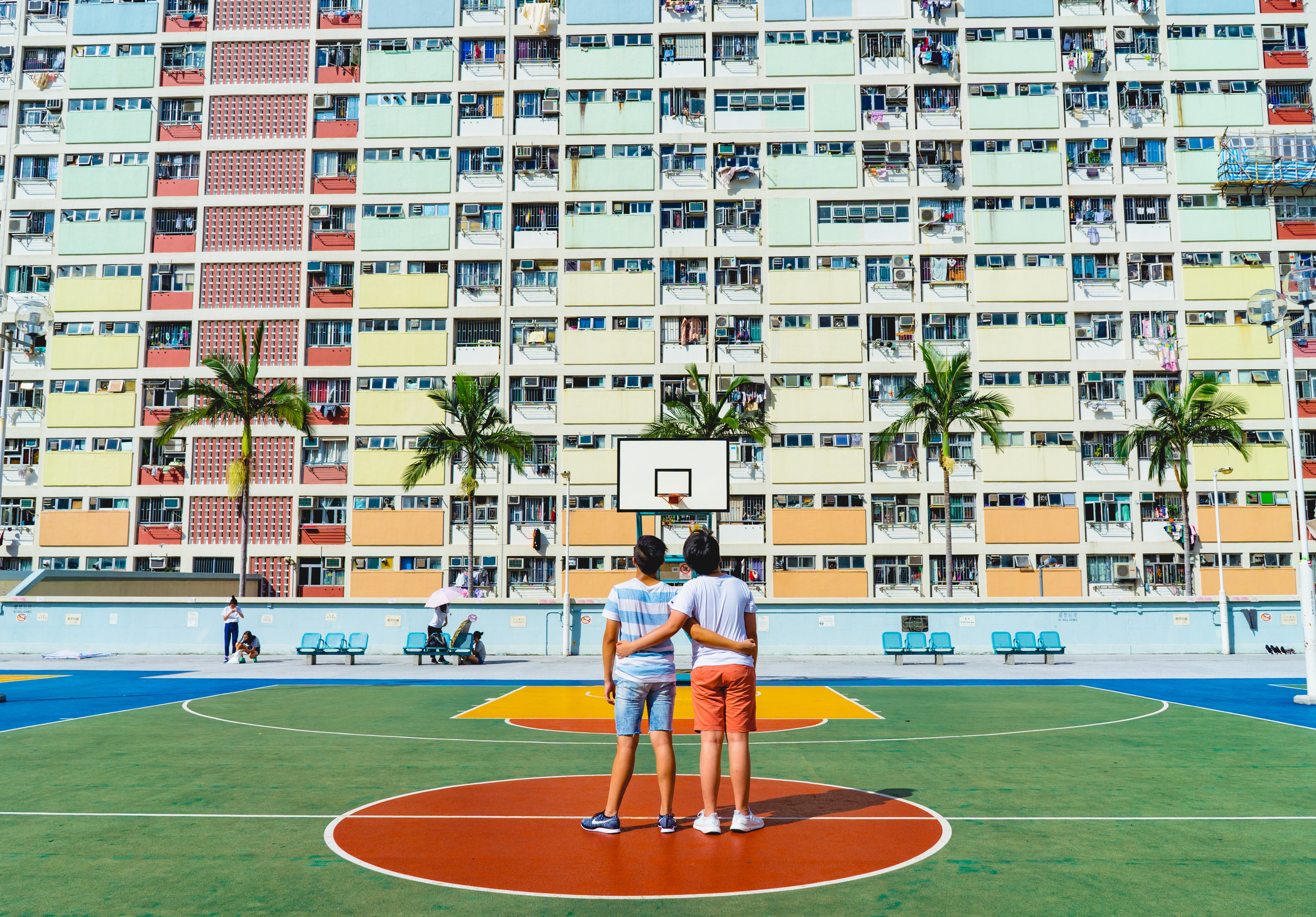 Friends Playing Basketball in a City